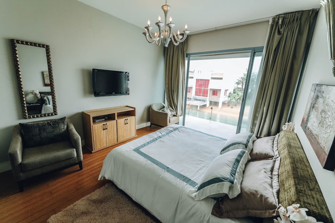 bedroom where curtains cover entire wall