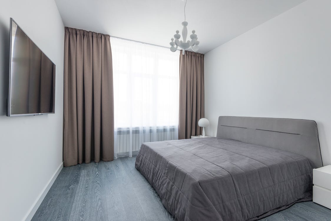 brown custom-made drapes in a bedroom