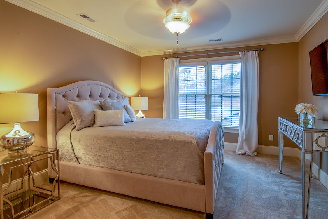 bedroom with long curtains